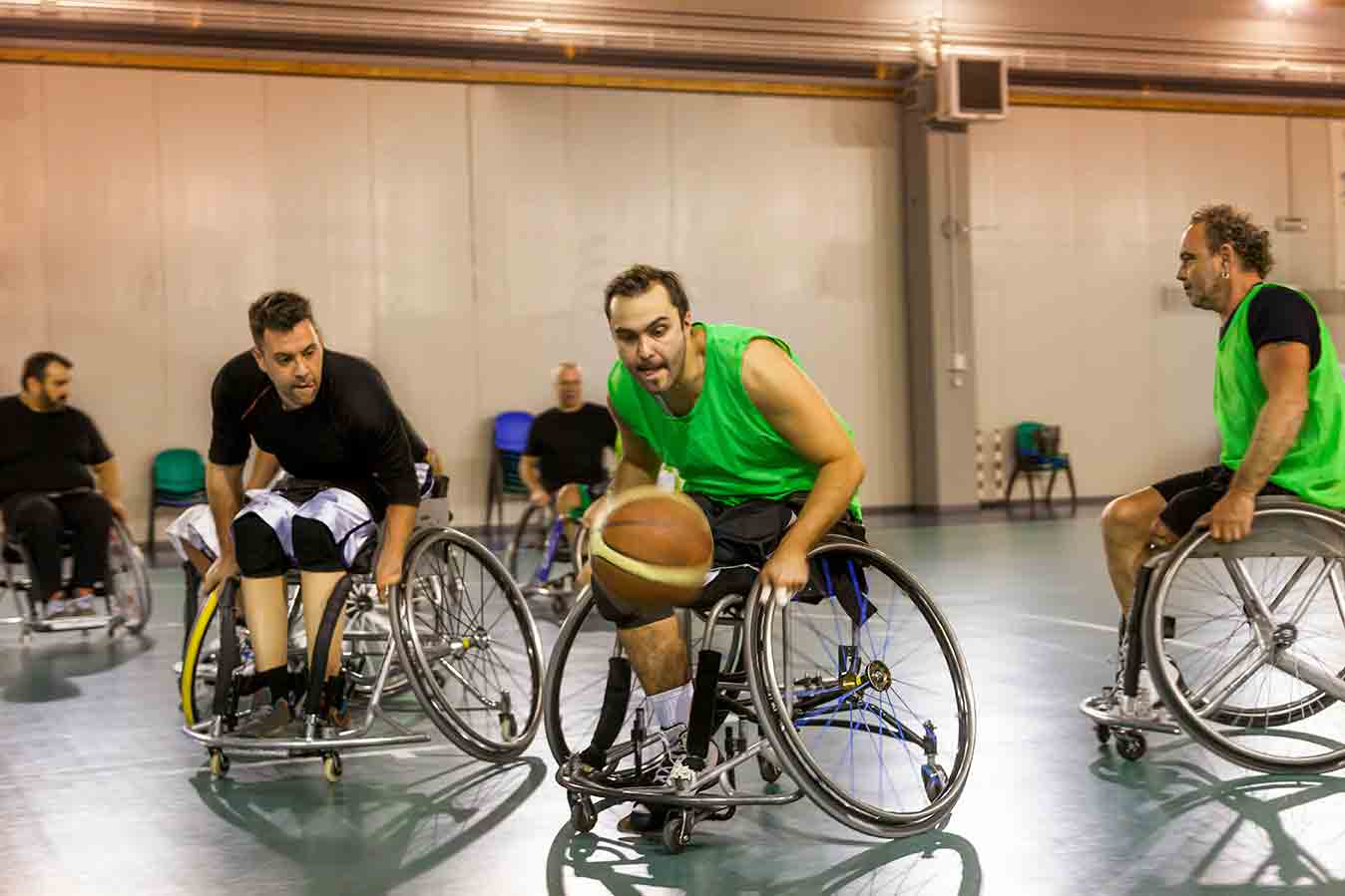 Men playing wheelchair basketball