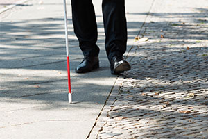 eCane - a man walking with a cane
