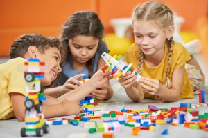 children with adhd playing with lego indoors