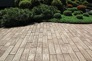 Decking surrounded by green garden