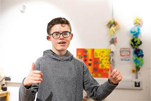 George Cook learning sign language