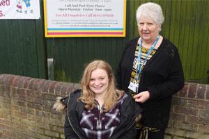 Hightown resident Mimi outside her dream job